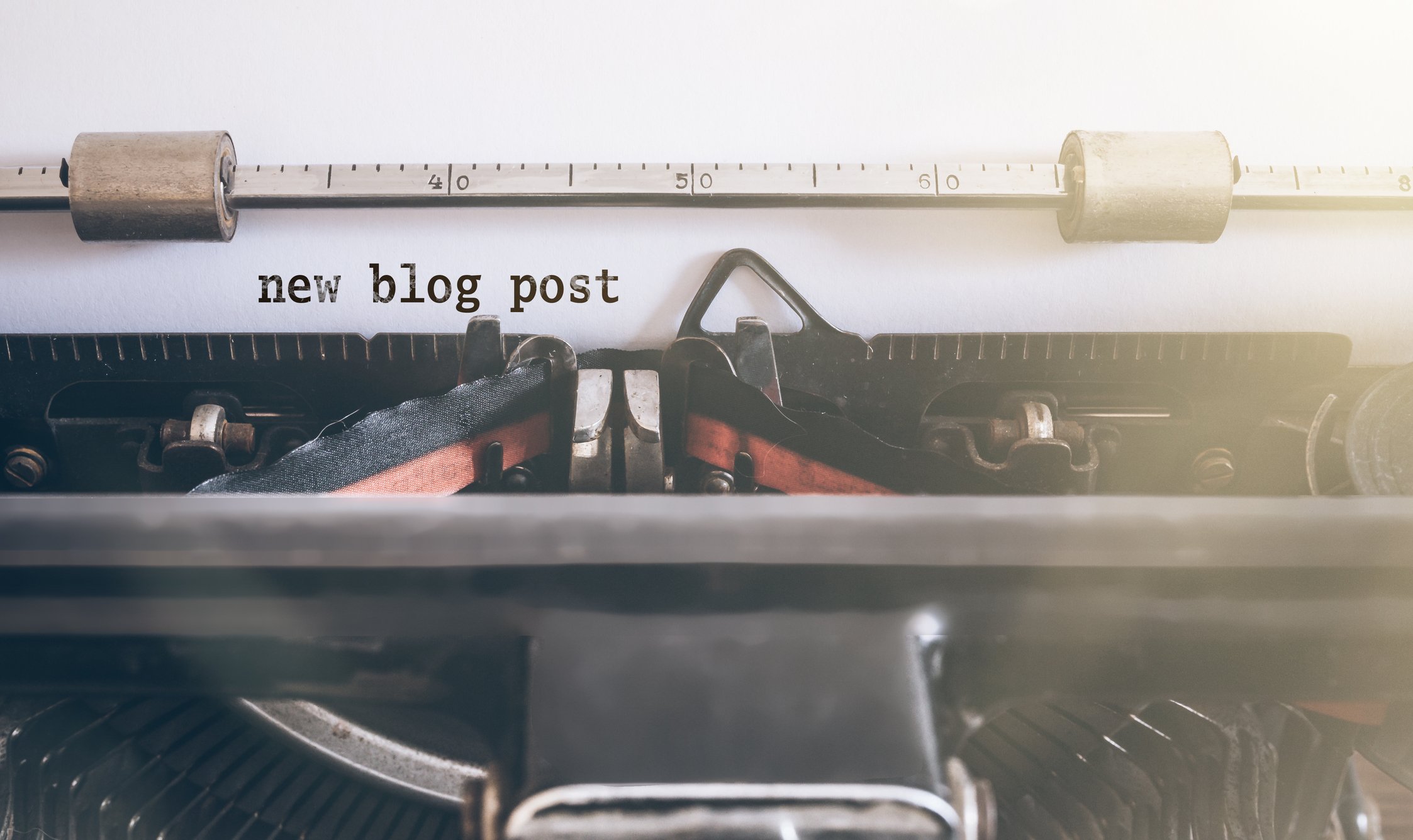 words new blog post written on vintage manual typewriter